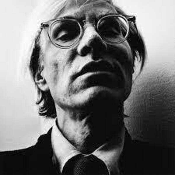 Artist Andy Warhol captured in portrait.