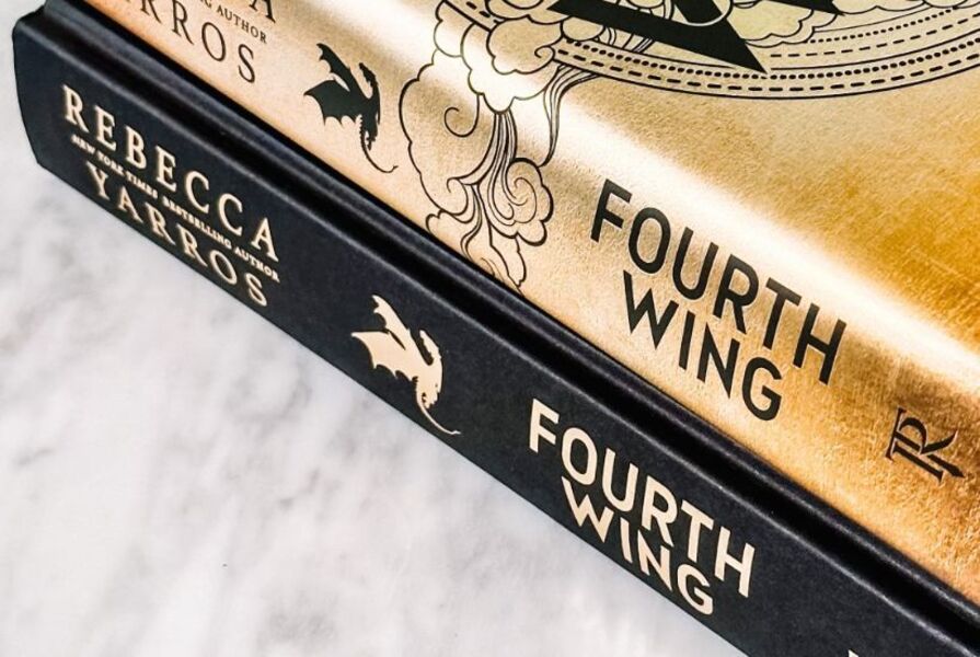 Side view of hardcover Fourth Wing by Rebecca Yarros