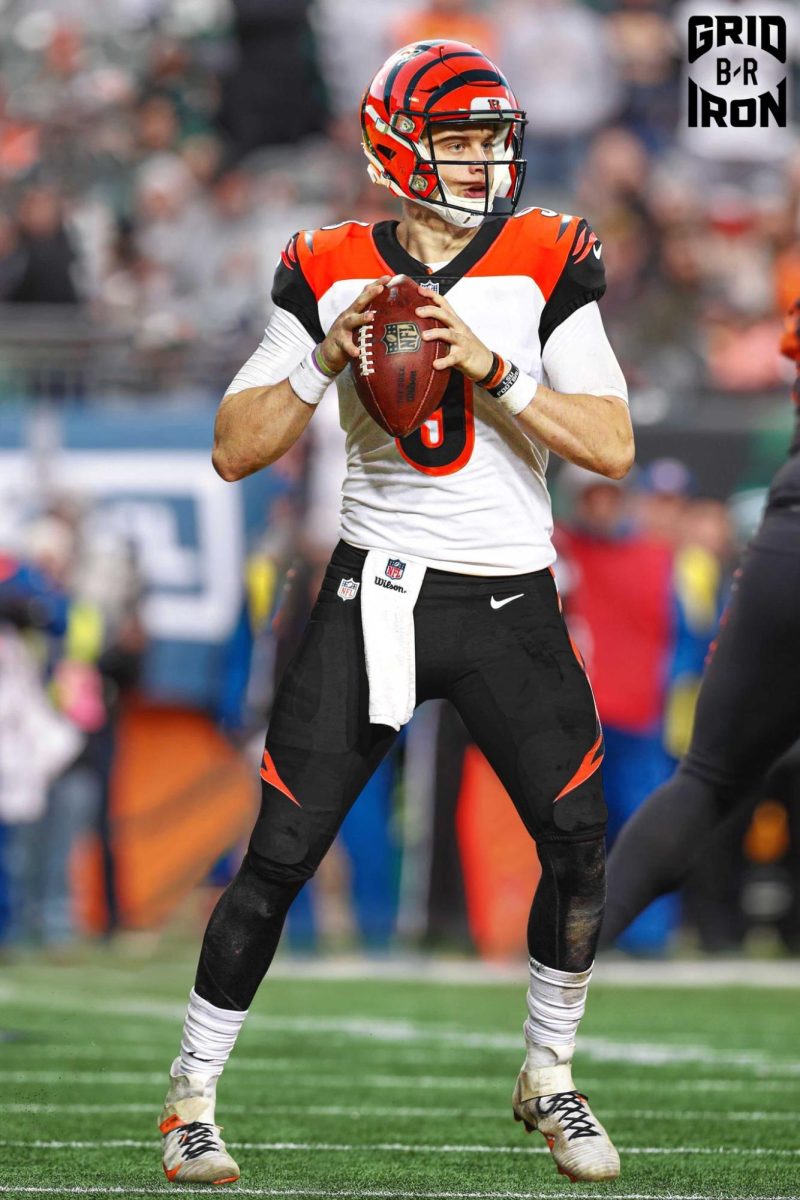 Cincinnati Quarterback, Joe Burrow, preparing to throw a pass.