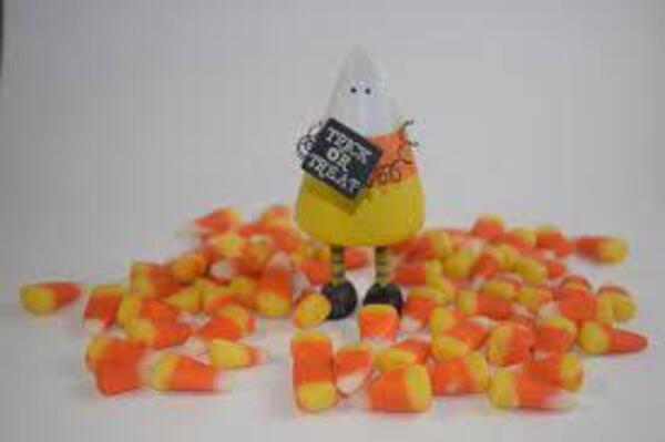 Silly Candy corn dude holding a sign