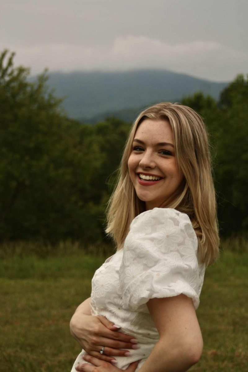 Forth poses for her graduation photos
