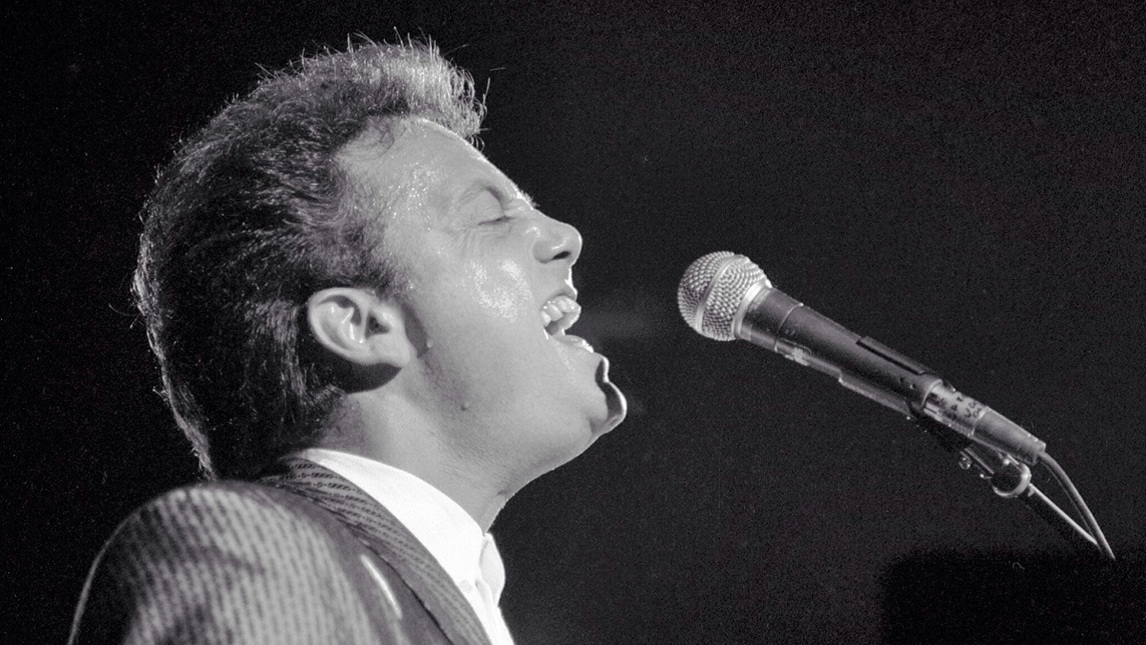 Billy Joel performing in his earlier years.