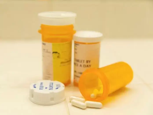 Fentanyl bottles seized in a cartel lab, showcasing the dangerous scale of drug production. 