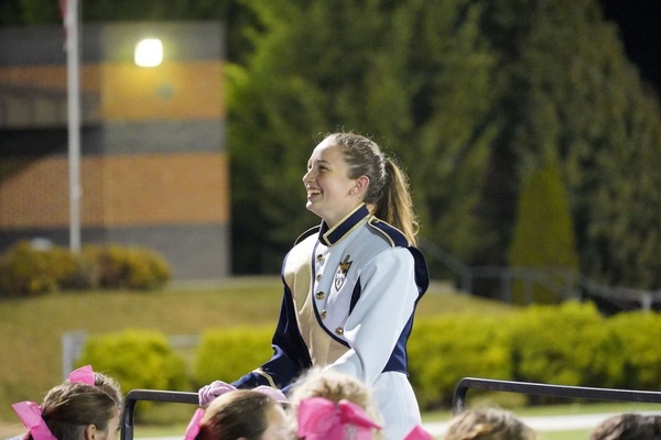 Aliza Harner (12) directs the band on a football game night at Bogle Stadium. 