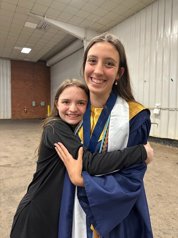 Grace Kinzie (Right) with reporter Lily Ratliff at Graduation. 