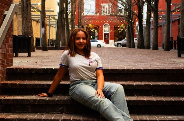 Erica Brown sitting on stairs in downtown Roanoke, Virginia.