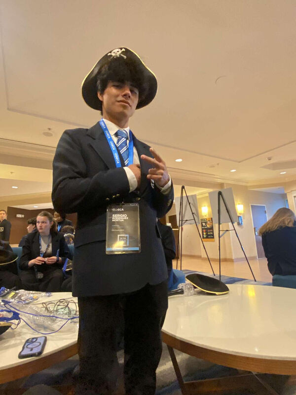 Sergio strikes a pose at a DECA event.
