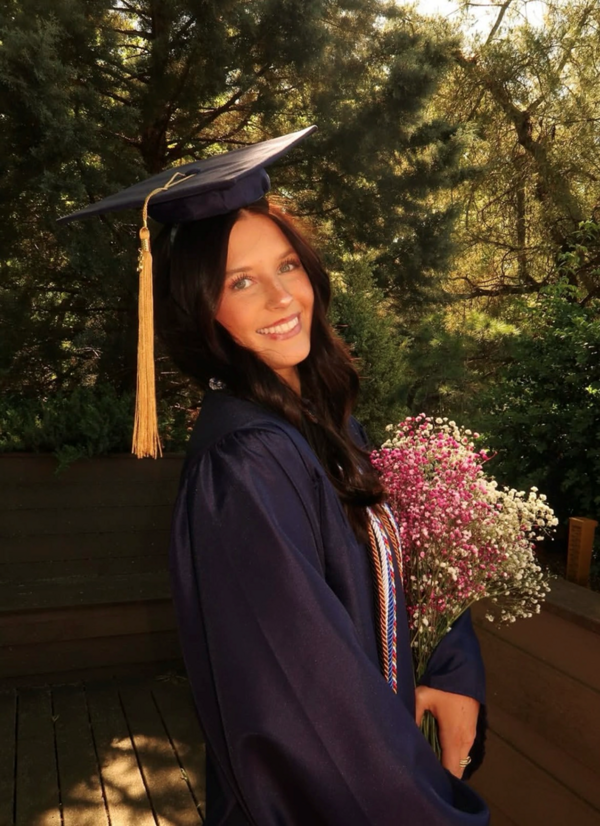 Claire Mitchell posing for her senior grad pics 